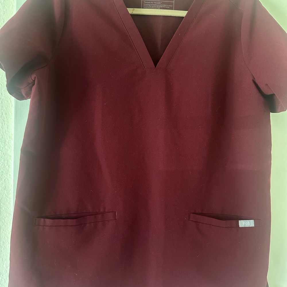 Women's Burgundy Figs top,  technical collection set, with black cargo pants.